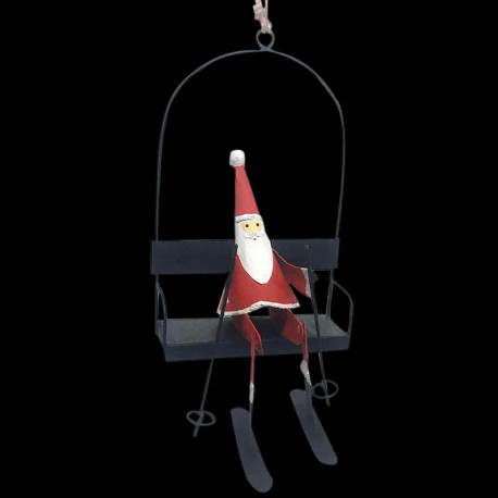 Père noël skiant sur une balançoire tôle